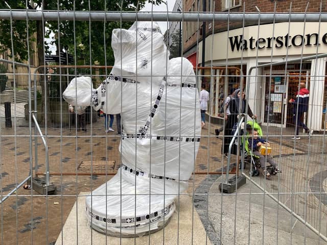The sculpture will remain under wraps until it is unveiled to the public on Friday.