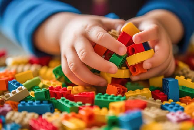 Child playing with blocks - stock image
