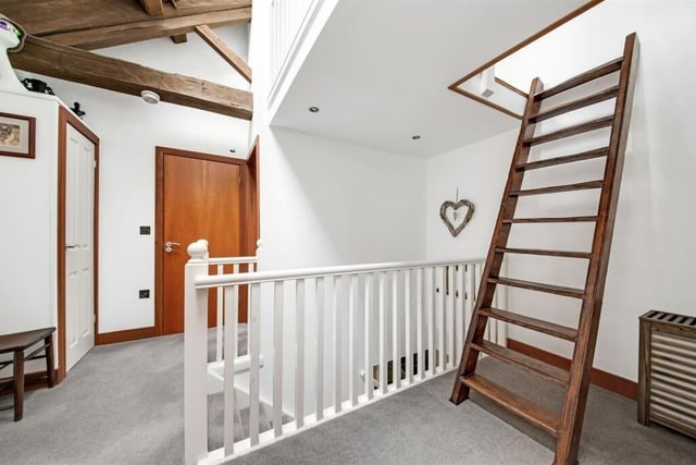 This 18th century timber ladder leads up to a versatile mezzanine area.