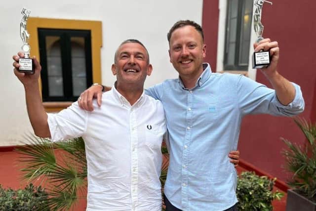 Spanish Blind Golf Open winner Andy Sellars and his guide Oliver Durham with their trophies.