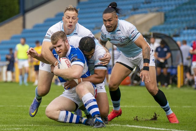 There is nowhere to go for this Halifax Panthers player as Featherstone Rovers tacklers combine well. Picture: Dec Hayes