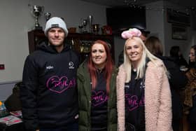 Organisors Mike Mould, Anna Walker and Kirsty Mould at Myla's Mission Christmas Fayre at Shaw Cross RL Club, Dewsbury