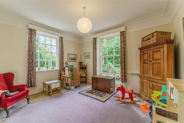 A double aspect reception room with sash windows.