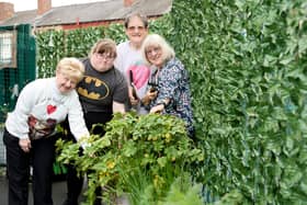 Councillor  Maureen Cummings with workers in the Agbrigg and Belle Vue Community Centre garden.