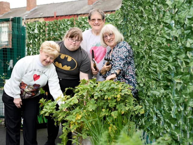 Councillor  Maureen Cummings with workers in the Agbrigg and Belle Vue Community Centre garden.