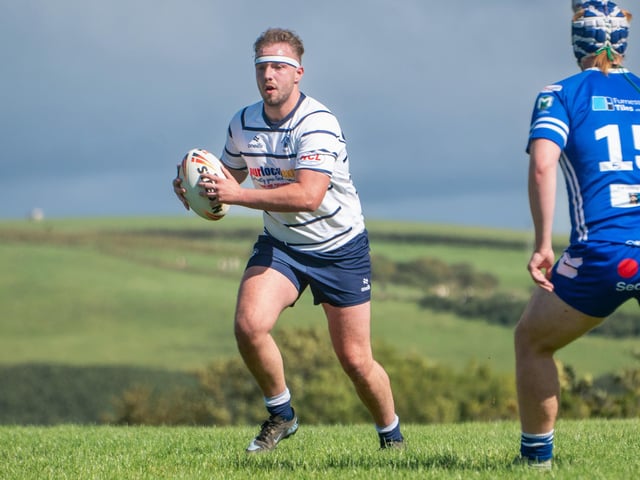 Leo Brown leads a first half charge up the Barrow hill.