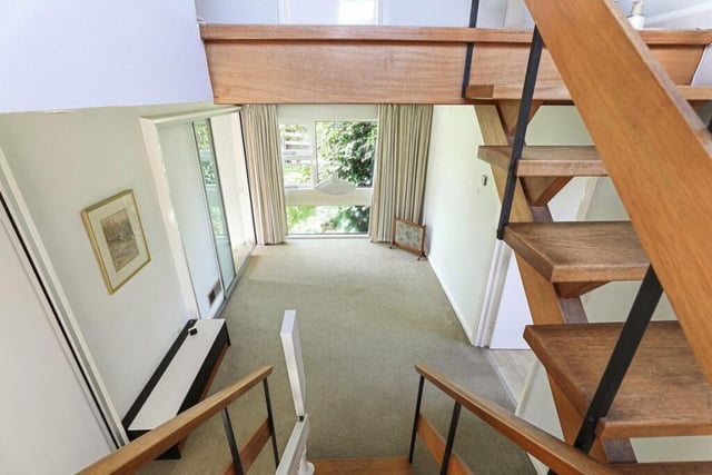 A bright interior with open plan staircase.