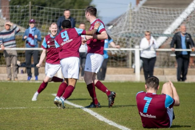 Emley players celebrate the first goal scored by Paul Walker.
