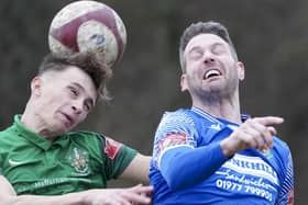 Gavin Allott challenges for a high ball in Pontefract Collieries' game against Brighouse Town. Picture: Scott Merrylees