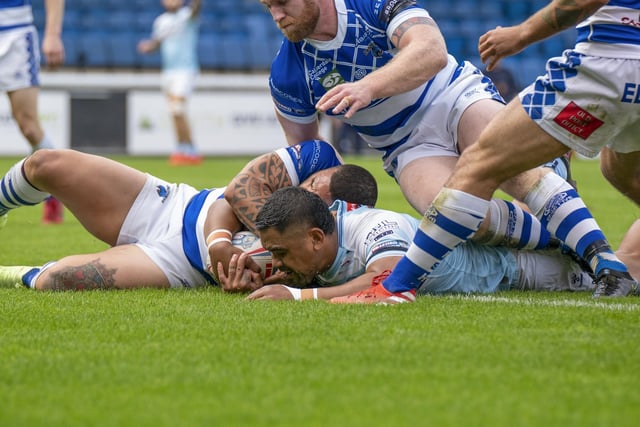 Junior Moors gets the ball down for a Featherstone Rovers try despite coming under pressure from several tacklers. Picture: Dec Hayes
