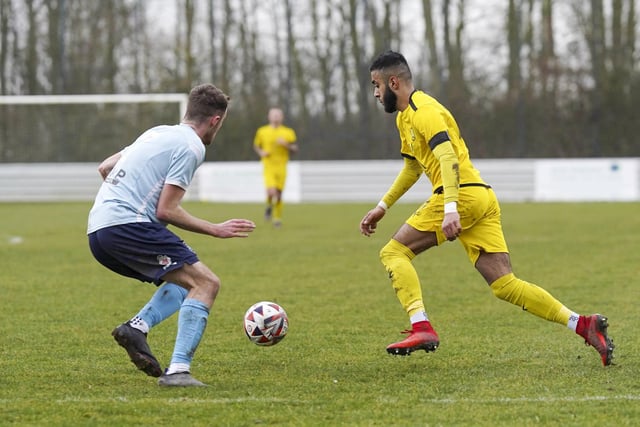 Tawheed Ahmed takes on a Beverley Town defender.