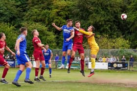 Mikey Dunn heads home the match clinching third goal for Pontefract Collieries against Ossett United. Picture: Josh Harper