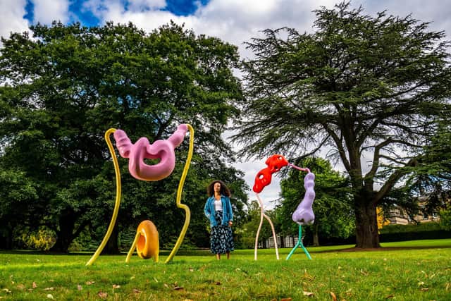 Dominique Lynch, PR and marketing assistant for Yorkshire Sculpture Park, near work by Vanessa da Silva, Muamba Grove #3 and Muamba Grove #4, 2019.