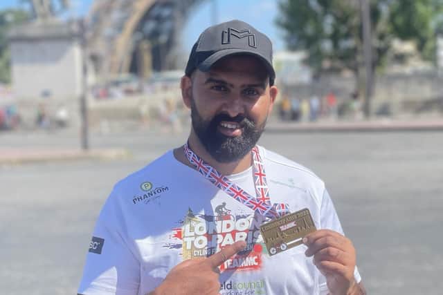 Coun Akef Akbar outside the Eiffel Tower in Paris, France.