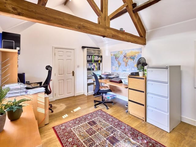 The once dilapidated outbuildings have been sympathetically converted to a annexe, with a flyover bridge leading to a home office.