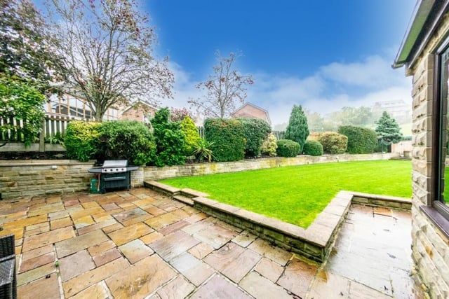 At the rear is the incredible large garden with two lovely large patio areas.