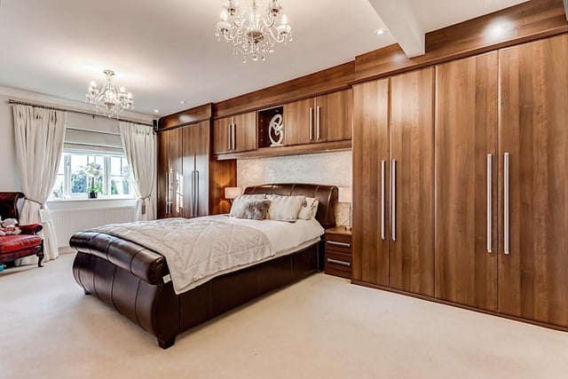 A very spacious double bedroom with fitted furniture.