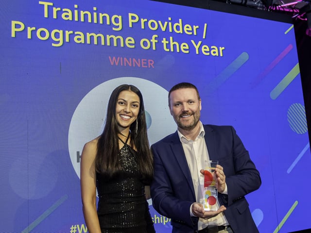 Abbey Maclure presents the award to a representative from Heart of Yorkshire Education Group's Apprenticeship Team