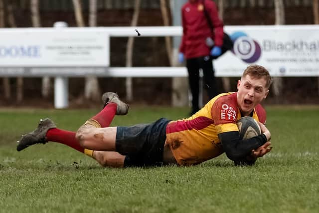 Jake Adams shows his delight as he dives over for the winning try for Sandal at Heath. Picture: Gareth Lyons