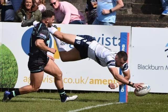 Gareth Gale comes up with a spectacular dive to score Featherstone Rovers' first try against Widnes Vikings. Picture: Rob Hare