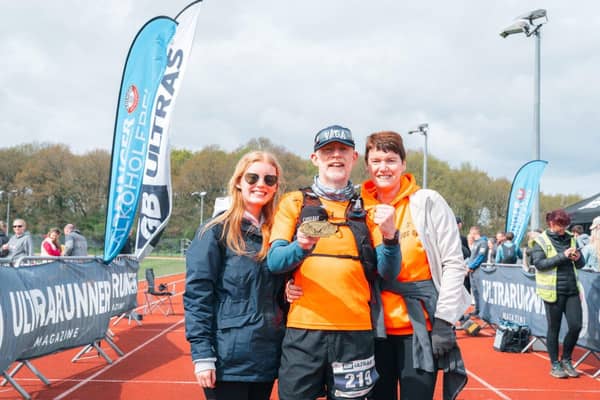 Simon, with his wife Rachael and daughter Megan, after completing the Chester Ultra 100