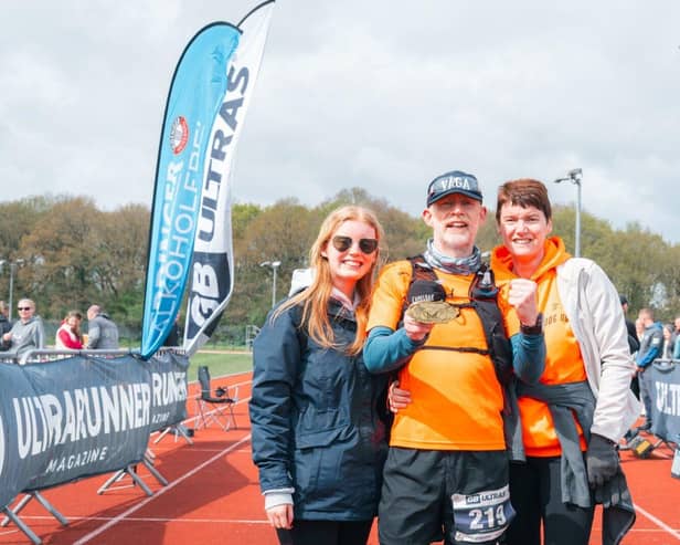 Simon, with his wife Rachael and daughter Megan, after completing the Chester Ultra 100