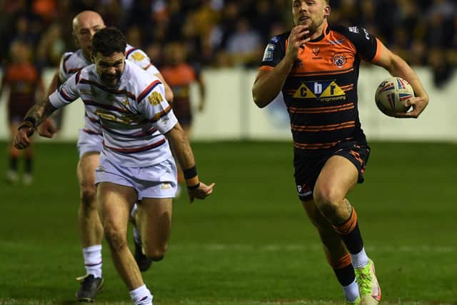 Greg Eden races clear for the first of his two tries for Castleford Tigers against Wakefield Trinity. Picture: Jonathan Gawthorpe