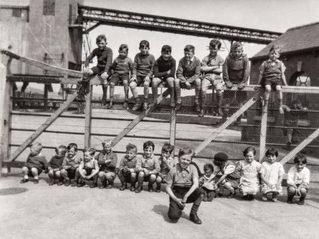 Children sitting on the railway gate at Fryston Colliery, 1940-1955