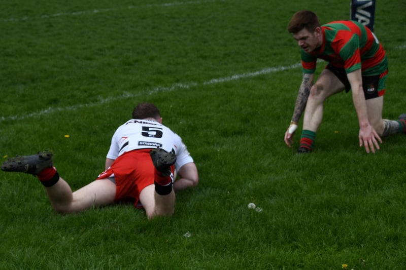 Elliot Davey dives over for one of his two tries.