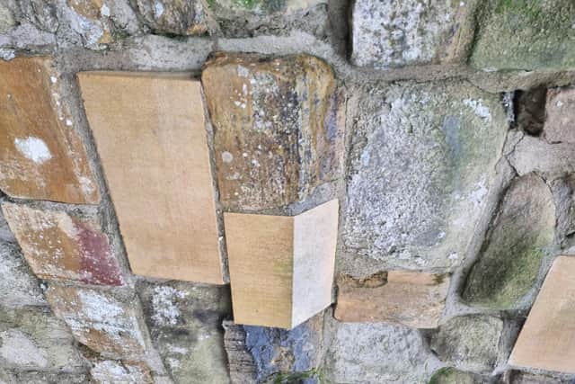 Honest repairs in the stonework at Pontefract Castle. The stonemasons will not distress any new stone so that visitors can distinguish between what is new and what is genuinely old