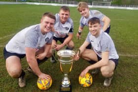 Goal scorers Tom Radley, Will Moreno, captain Tom Barber and man of the match George Whittaker have winning smiles after Old Junk Boys' 2-1 win over Hemsworth MW in the Premiership Two League Cup final.