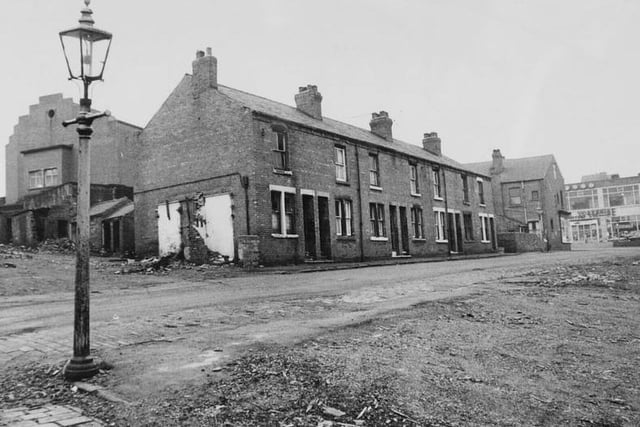 Terraced houses in Tanshelf, Pontefract, are demolished in 1967.