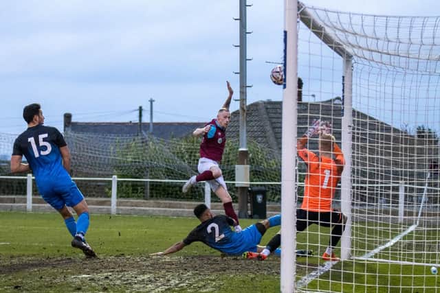 Ross Hardaker hits the woodwork with this late chance after getting into the box for Emley against Maltby Main. Picture:Mark Parsons