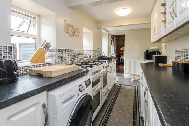 The kitchen has a full range of fitted units.