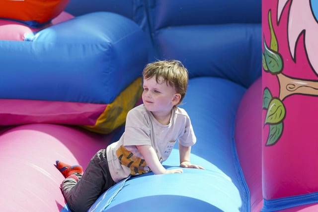 Children got to enjoy bouncy castles and thrilling funfair rides.