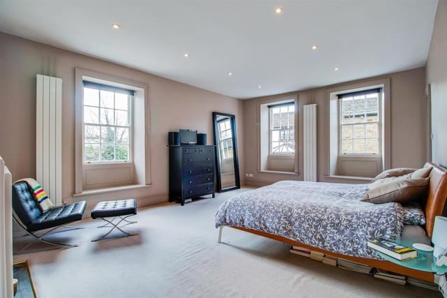 The principal bedroom is incredibly spacious and features an en--suite bathroom.