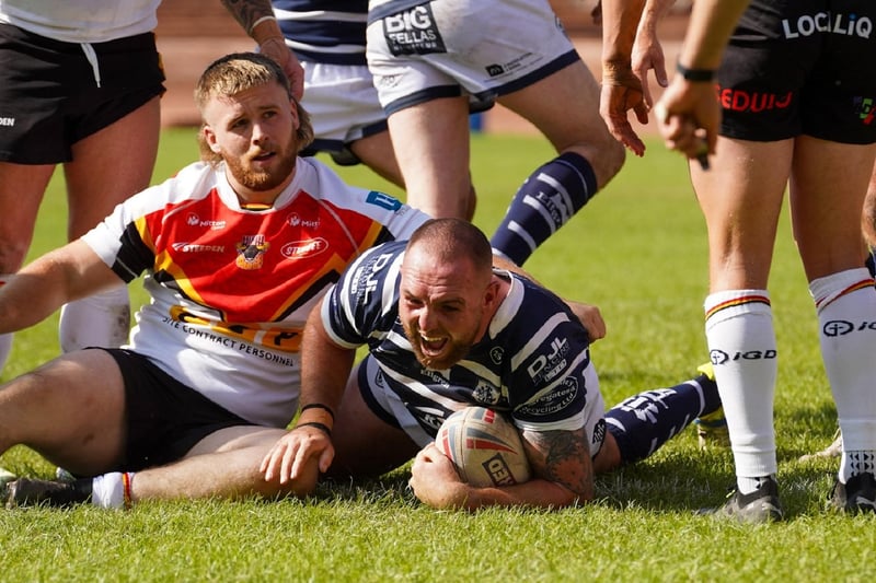 Daniel Smith dives over for Featherstone Rovers' opening try at Bradford.