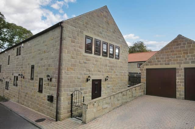 This property in Orchard Court, Badsworth, Pontefract, is priced at £415,000.
