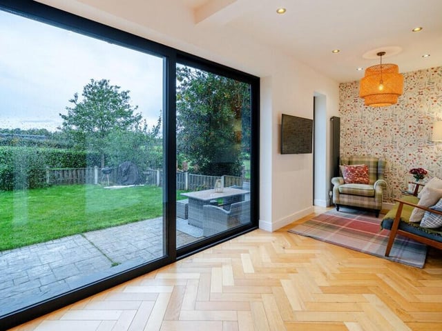 The home embraces indoor to outdoor living, with bi-fold doors from the open plan living area.