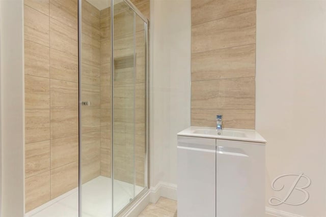 This walk-in shower is part of the en suite facilities for the downstairs bedroom.