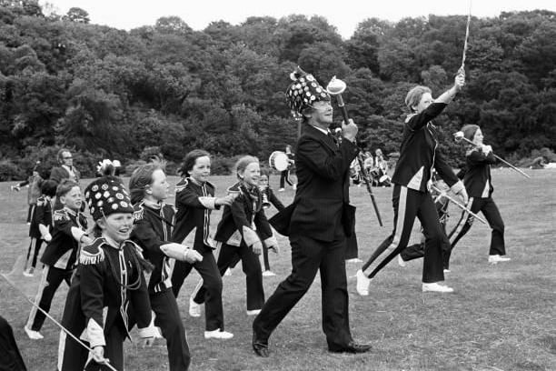 Young children with their band leaders participating in the Yorkshire Miners' Gala near Wakefield, West Yorkshire, circa 1976. This image is from a series of social documentary photographs illustrating some English traditions and eccentricities, taken from the book 'Being English' by Patrick Ward, published in 2014. (Photo by Patrick Ward/Popperfoto via Getty Images)