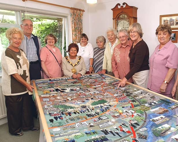 The then Mayor of Wakefield, Janet Holmes (seated), with the Horbury Tapestry and some of the stitchers. (Left to right) Janet Taylor, Geoff and Sylvia Spiller, Molly Partinton, Olive Sargeant, Gladys Spell, Pat Bradley, Hilary Elstone, Yvonne Townsend, Eileen Brewer, pictured in 2004. Picture: Peter Vickers