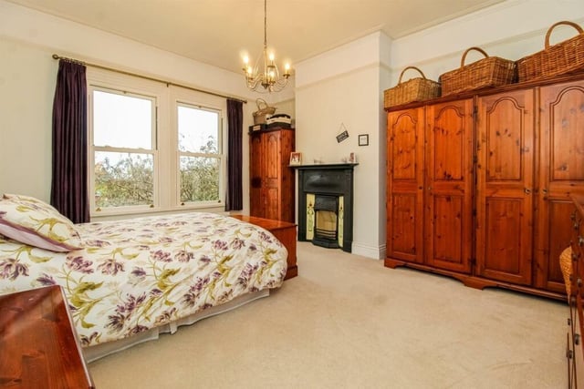 Bedroom two also features a cast iron fireplace with tiled surround, coving to the ceiling and a picture rail.