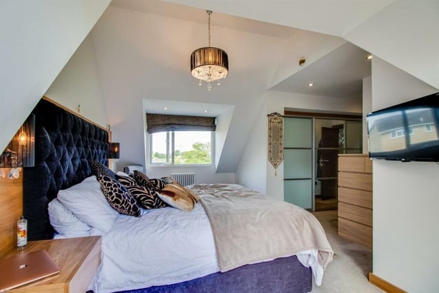 The principal bedroom enjoys UPVC double glazed doors opening onto the balcony area and fitted wardrobes with sliding partial mirrored doors.