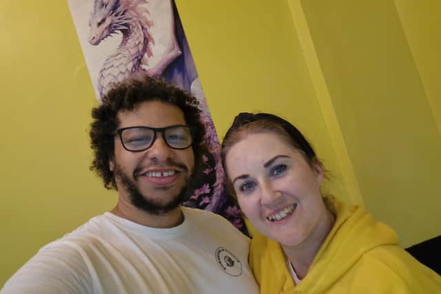 Owner of Dungeons and Donuts, Andy, with partner Emily on opening day.
