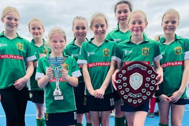 Slazenger Hockey Club girls U12s' show off their Yorkshire League trophies.