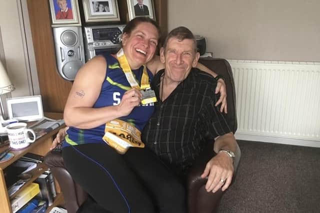 Sarah Swift and her dad Brian Helliwell after she ran in the Leeds half marathon in aid of the Alzheimer's Society.