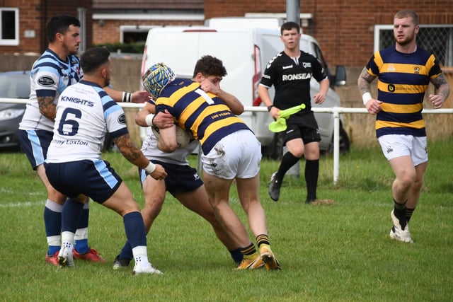 The Clock Face Miners full-back is stopped in his tracks. Picture: Rob Hare