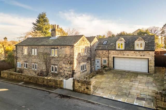 A front view of Pooh Cottage, for sale at £1.35m in the village of Woolley.