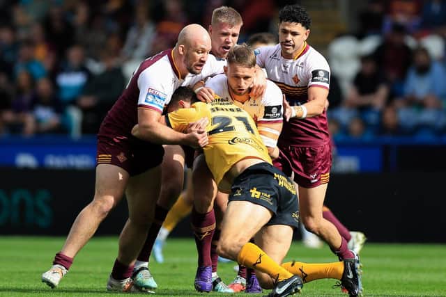 Castleford Tigers winger Louis Senior is tackled against his former club. Picture by Callum Pilkington/SWpix.com